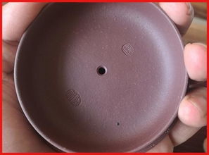 通过紫砂壶的壶盖辨别全手工还是半手工